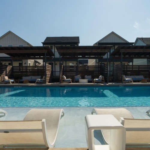 a pool with chairs around it