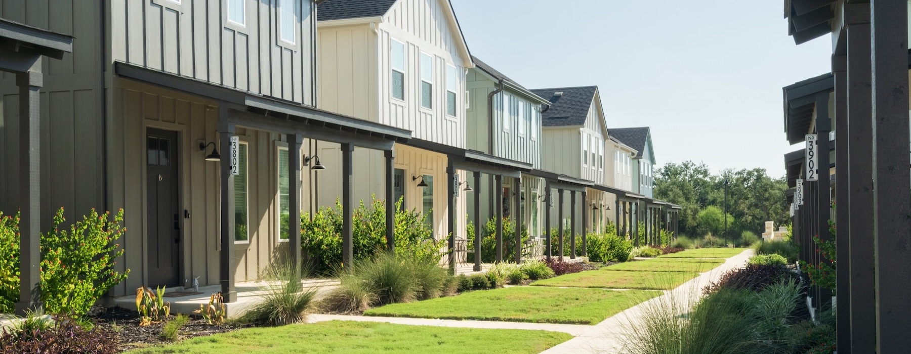 a row of houses with walkways