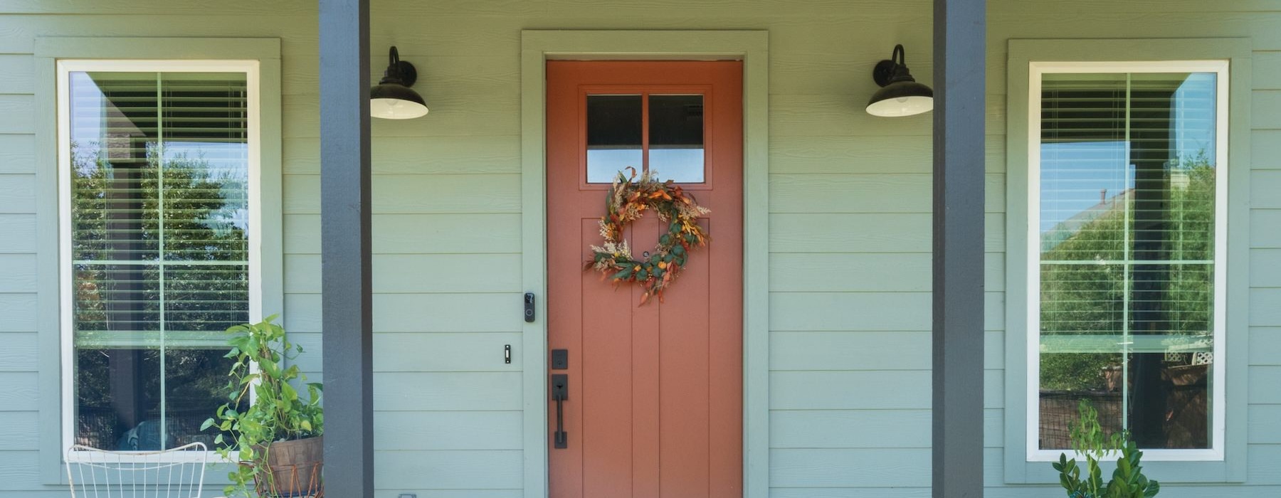 a house with a red door and windows