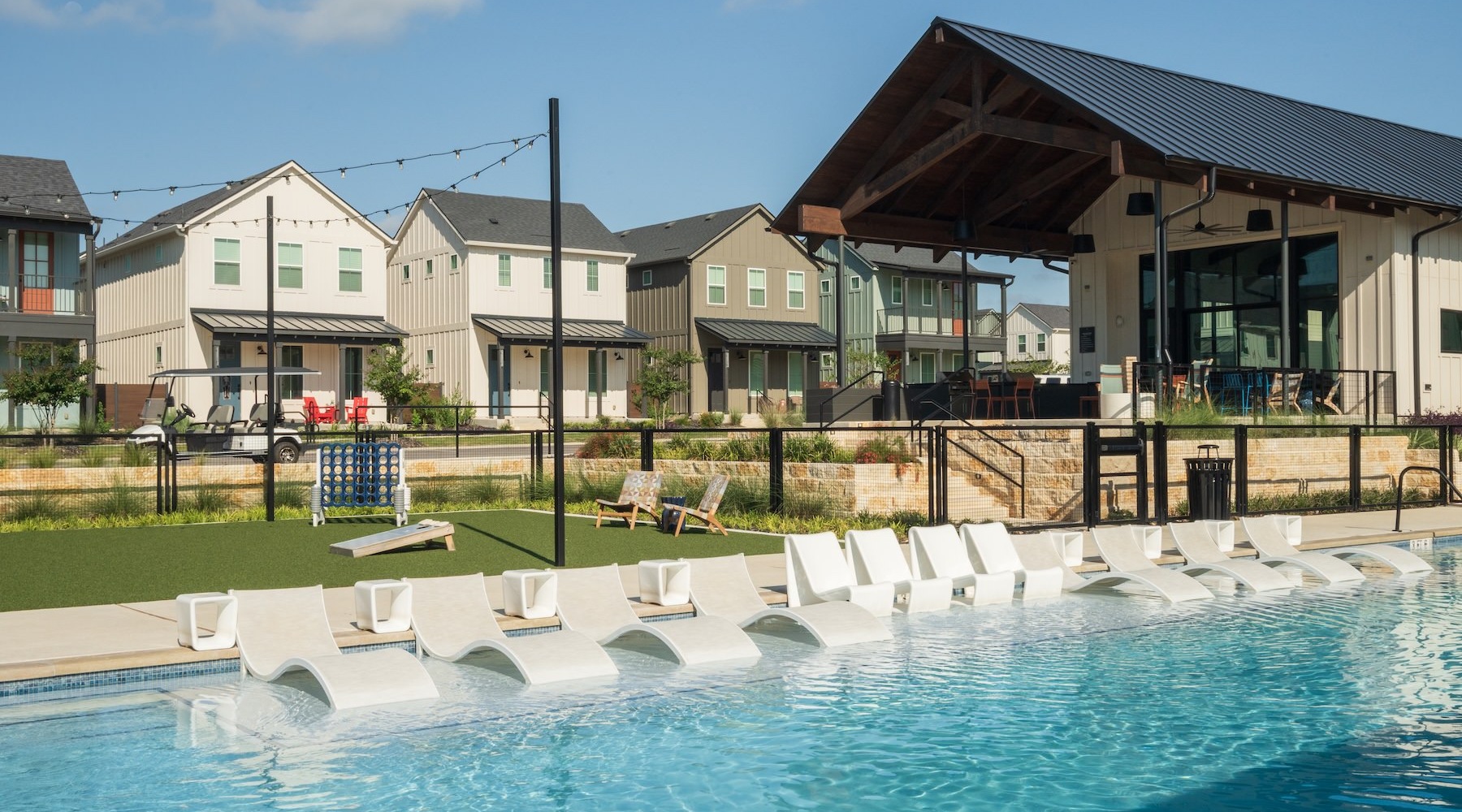a pool with chairs around it
