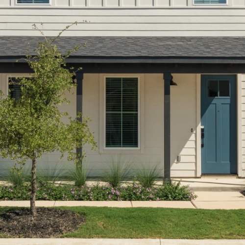 a house with a tree in front